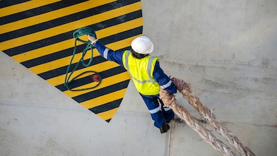 Man pulling pipe